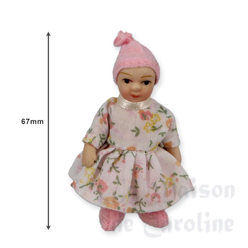 Bébé fille assise robe rose à fleurs Bilder 1