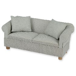 Sofa gris à pois avec 2 coussins